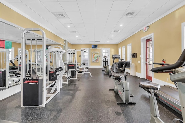 exercise room featuring a drop ceiling, visible vents, baseboards, and recessed lighting