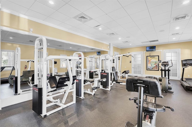 workout area with visible vents and a drop ceiling