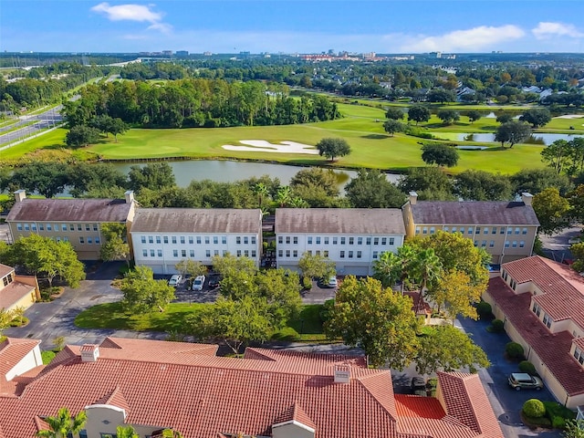 drone / aerial view featuring a water view and golf course view