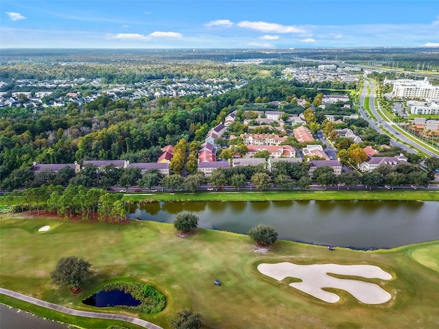 bird's eye view with a water view and view of golf course