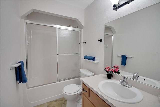 bathroom featuring vanity, toilet, and enclosed tub / shower combo