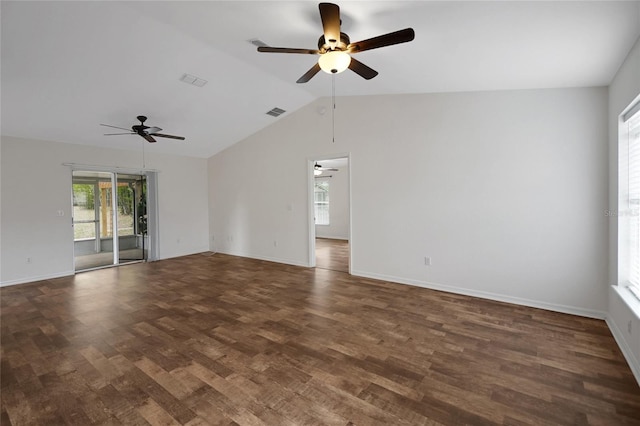 empty room featuring ceiling fan, lofted ceiling, wood finished floors, and baseboards