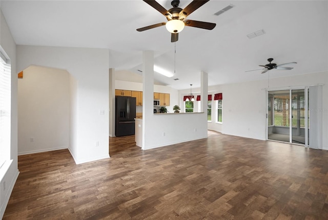 unfurnished living room featuring a ceiling fan, dark wood finished floors, lofted ceiling, and baseboards