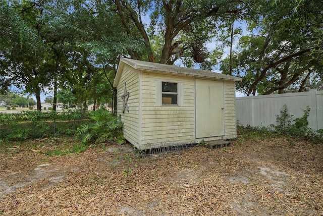 view of shed with fence