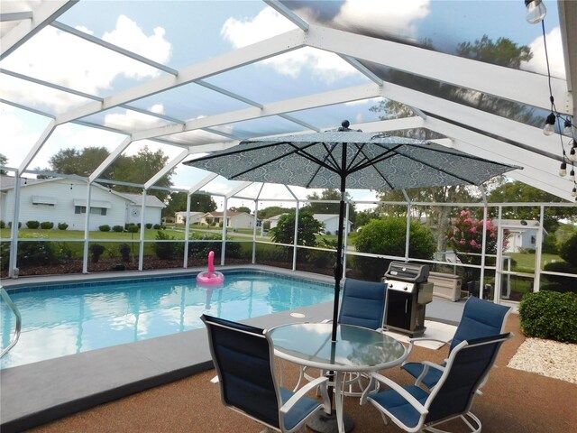 17819 SE 105th Ct, Summerfield, FL 34491 - outdoor pool with a patio area, a lanai, and area for grilling