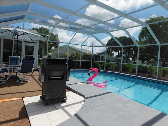 17819 SE 105th Ct, Summerfield, FL 34491 - outdoor pool featuring a patio area, grilling area, and a lanai