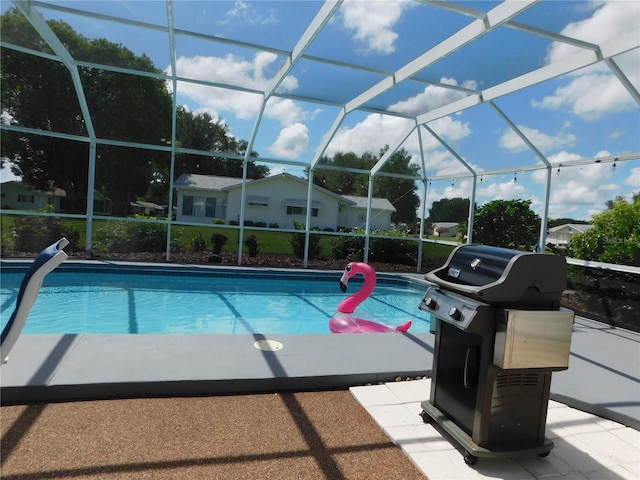 17819 SE 105th Ct, Summerfield, FL 34491 - swimming pool featuring a grill and glass enclosure