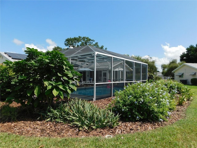 17819 SE 105th Ct, Summerfield, FL 34491 - rear view of property featuring an outdoor pool and a lanai