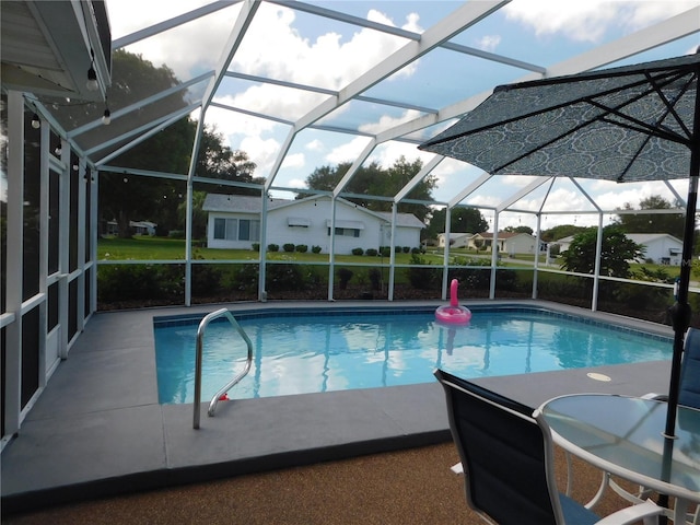 17819 SE 105th Ct, Summerfield, FL 34491 - outdoor pool featuring glass enclosure and a patio