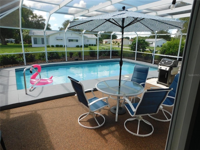 17819 SE 105th Ct, Summerfield, FL 34491 - swimming pool with a lanai, a patio area, and area for grilling