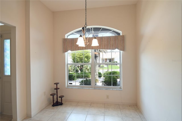2120 Willow Grove Way, The Villages, FL 32162 - unfurnished dining area featuring a chandelier and baseboards