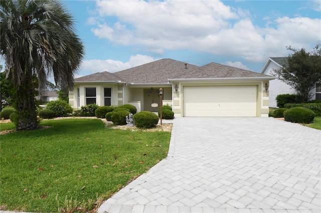 3177 Williams Rd, The Villages, FL 32162 - single story home featuring stucco siding, decorative driveway, a front yard, and a garage