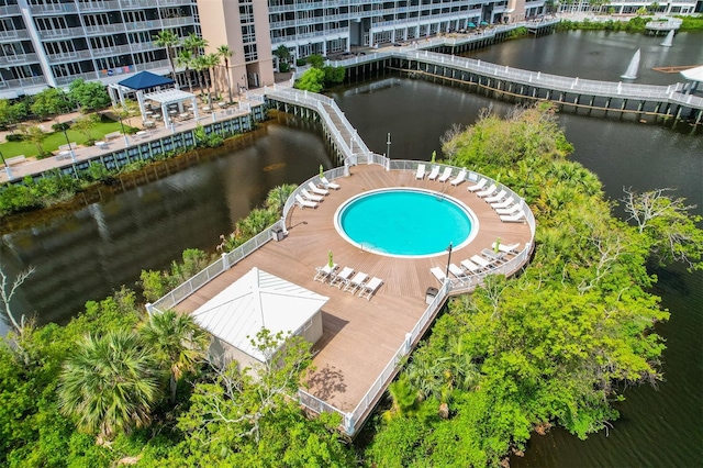 aerial view of a nearby body of water and a pool area