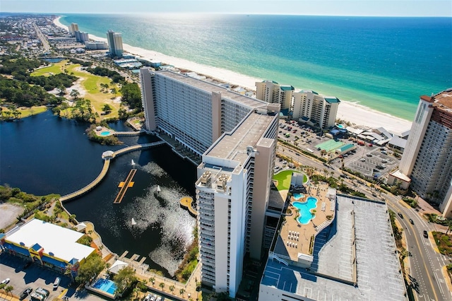 drone / aerial view of a large body of water and a pool area