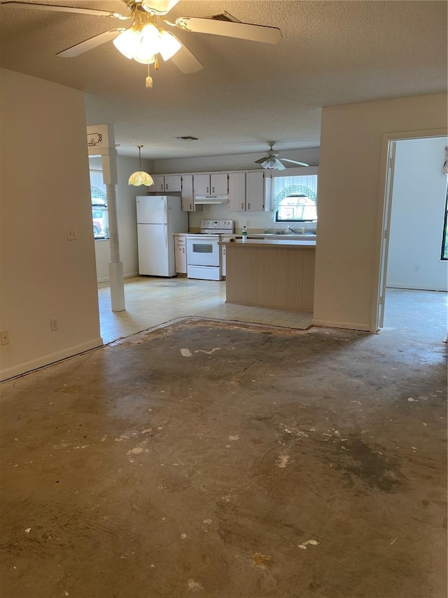 2421 Centennial Blvd, Leesburg, FL 34748 - unfurnished living room featuring a ceiling fan, unfinished concrete flooring, a sink, and baseboards