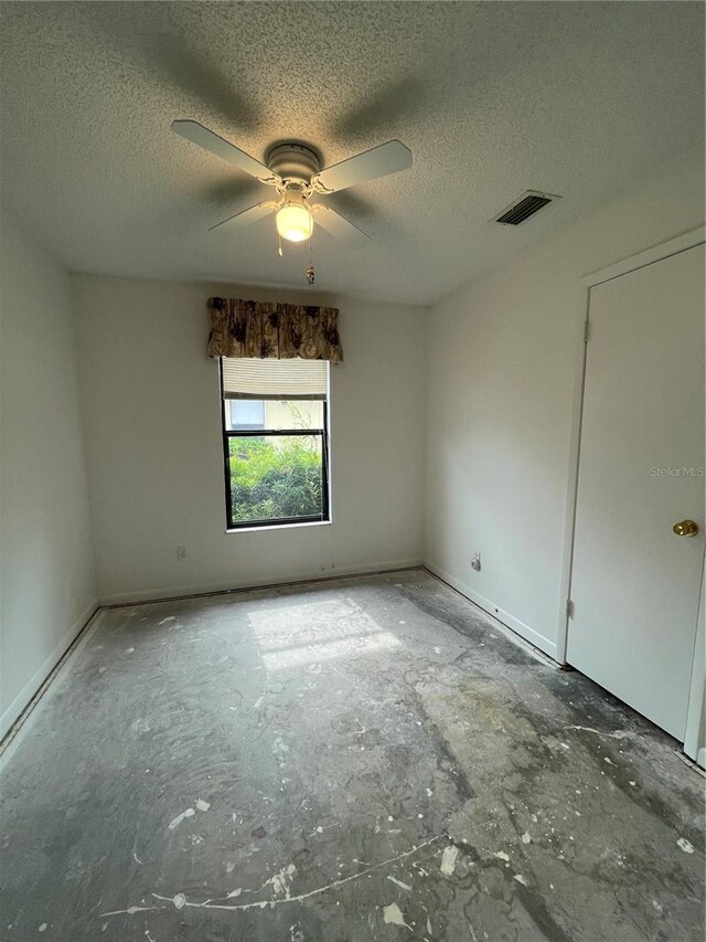 2421 Centennial Blvd, Leesburg, FL 34748 - empty room featuring a textured ceiling and a ceiling fan
