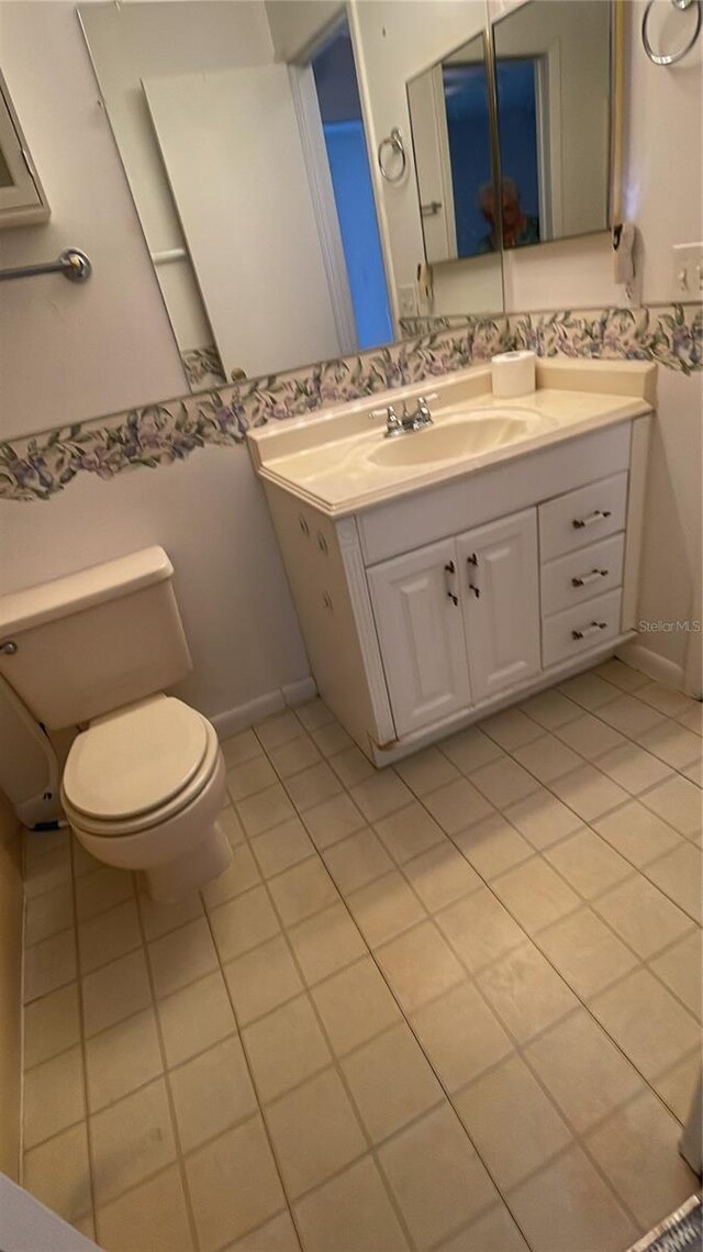 2421 Centennial Blvd, Leesburg, FL 34748 - bathroom featuring tile patterned flooring, toilet, and vanity