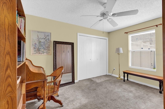 8932 SE 168th Sedgwick Pl, The Villages, FL 32162 - office area featuring a textured ceiling, a ceiling fan, carpet floors, and baseboards