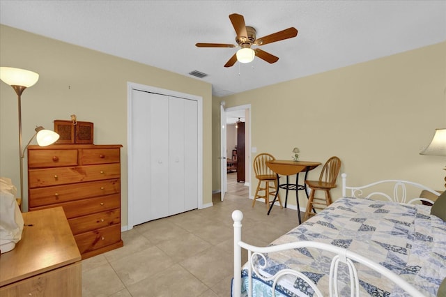 8932 SE 168th Sedgwick Pl, The Villages, FL 32162 - bedroom with light tile patterned flooring, a closet, and a ceiling fan