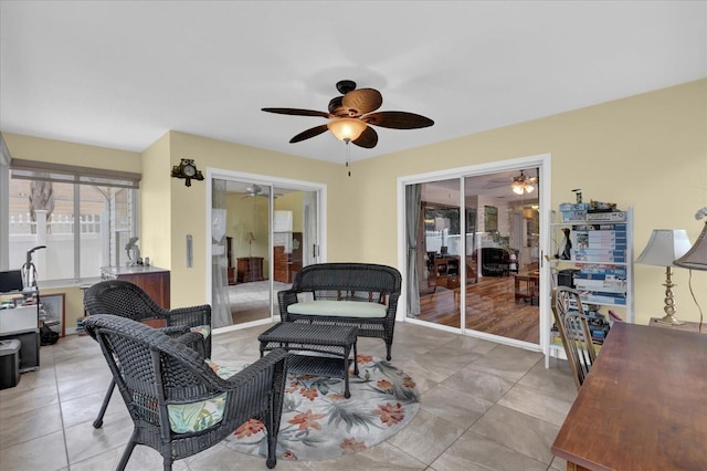 8932 SE 168th Sedgwick Pl, The Villages, FL 32162 - living room with ceiling fan and light tile patterned flooring