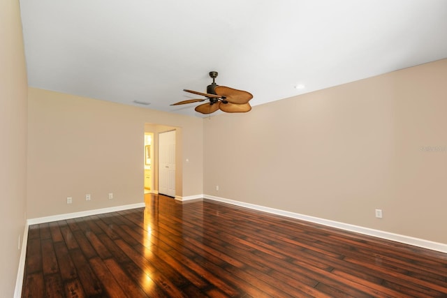 spare room with baseboards, dark wood-style flooring, a ceiling fan, and recessed lighting
