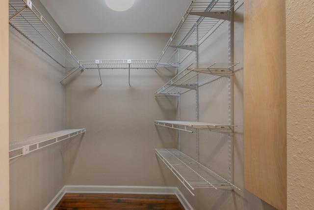 spacious closet with wood finished floors