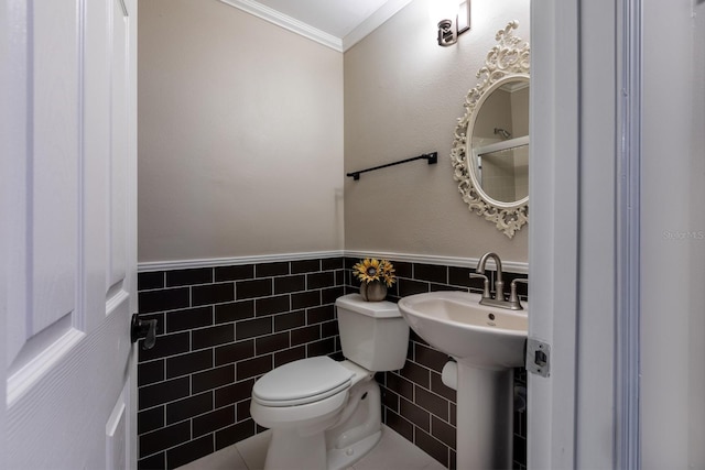 8738 SW 95th Ln Unit B, Ocala, FL 34481 - bathroom with tile walls, ornamental molding, and a wainscoted wall