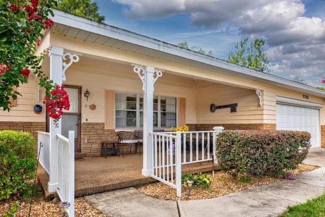 8738 SW 95th Ln Unit B, Ocala, FL 34481 - doorway to property with a porch and a garage
