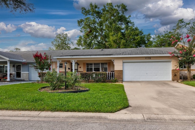 8738 SW 95th Ln Unit B, Ocala, FL 34481 - ranch-style home featuring an attached garage, a front yard, driveway, and covered porch