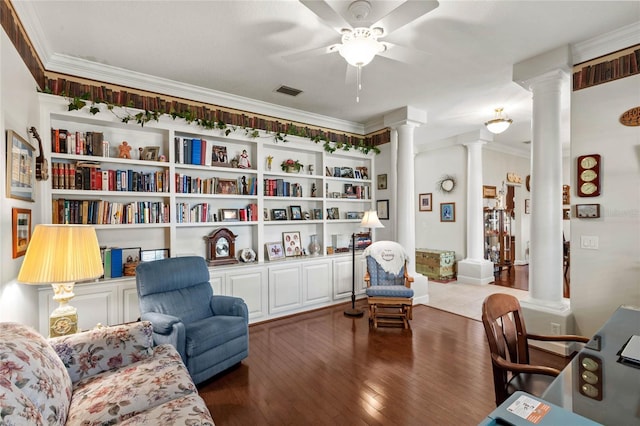 office space with decorative columns, a ceiling fan, crown molding, and wood-type flooring