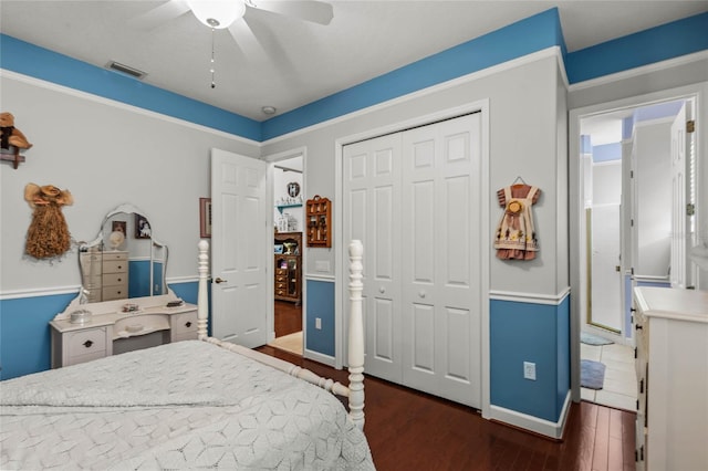 bedroom featuring dark wood finished floors, a closet, ceiling fan, and baseboards