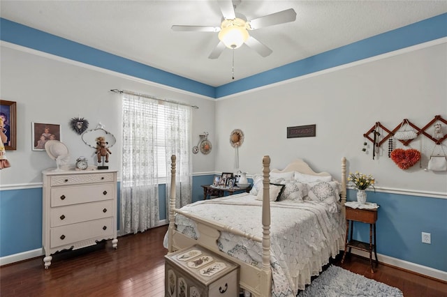 bedroom with wood-type flooring, baseboards, and a ceiling fan