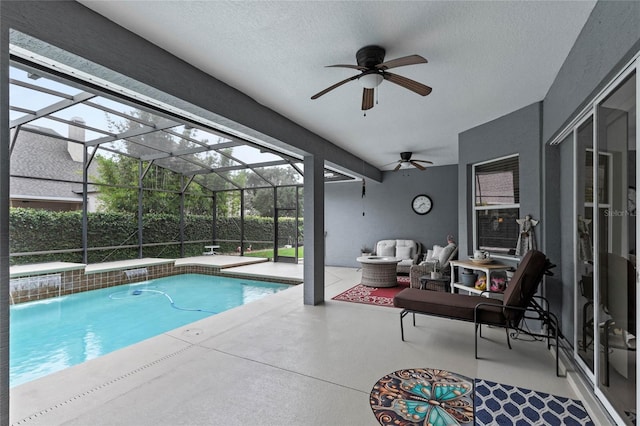 outdoor pool with a patio, a ceiling fan, an outdoor hangout area, and a lanai