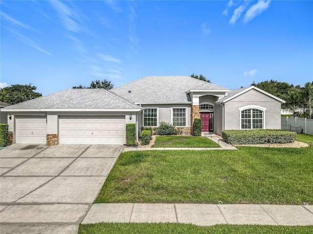 3731 Peaceful Valley Dr, Clermont, FL 34711 - single story home featuring a garage, stucco siding, concrete driveway, stone siding, and a shingled roof