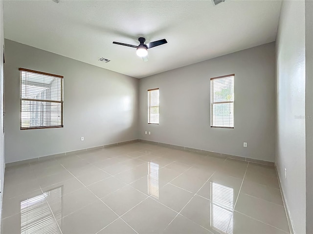3731 Peaceful Valley Dr, Clermont, FL 34711 - spare room with ceiling fan and light tile patterned floors
