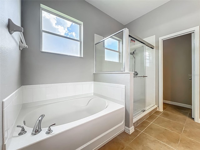 3731 Peaceful Valley Dr, Clermont, FL 34711 - bathroom with a bath, a stall shower, and tile patterned floors