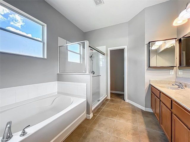 3731 Peaceful Valley Dr, Clermont, FL 34711 - bathroom with a garden tub, vanity, a stall shower, and tile patterned flooring