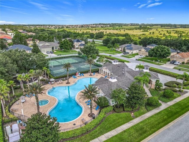 3731 Peaceful Valley Dr, Clermont, FL 34711 - aerial view of property's location featuring a pool and nearby suburban area