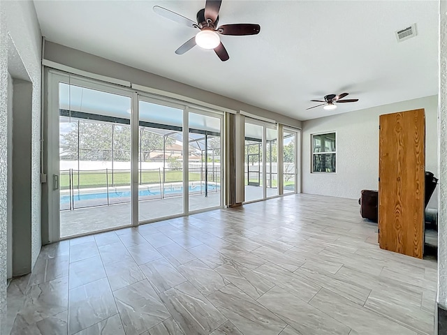 3731 Peaceful Valley Dr, Clermont, FL 34711 - unfurnished room with a ceiling fan and a textured wall