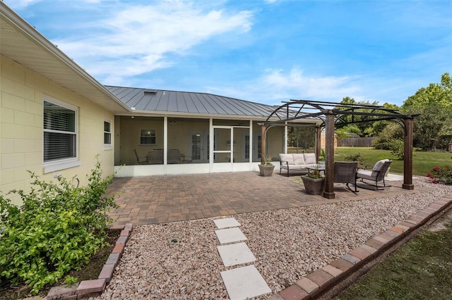 view of patio / terrace with an outdoor hangout area, a pergola, and a sunroom
