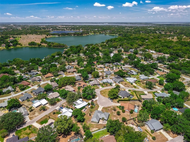 aerial overview of property's location featuring a large body of water and nearby suburban area