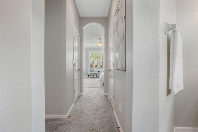 1027 Timbervale Trl, Clermont, FL 34715 - hallway featuring carpet flooring and arched walkways