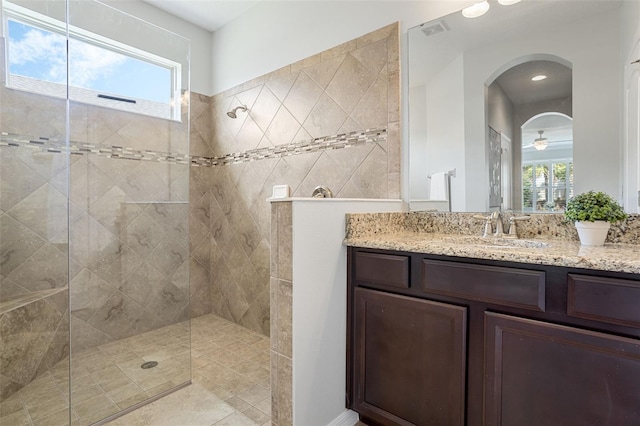 1027 Timbervale Trl, Clermont, FL 34715 - full bath featuring a walk in shower, vanity, and plenty of natural light