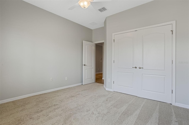 1027 Timbervale Trl, Clermont, FL 34715 - unfurnished bedroom with carpet, a closet, and a ceiling fan