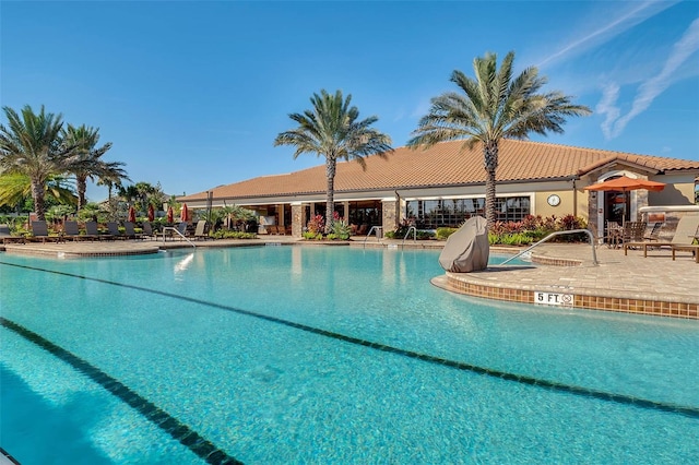 1027 Timbervale Trl, Clermont, FL 34715 - community pool with a patio
