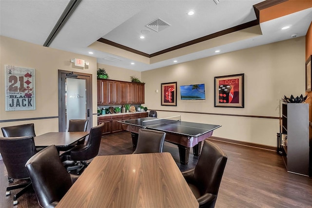 1027 Timbervale Trl, Clermont, FL 34715 - rec room with a tray ceiling, dark wood-style flooring, ornamental molding, and recessed lighting