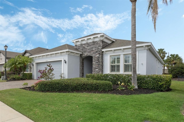 1027 Timbervale Trl, Clermont, FL 34715 - view of front of house with driveway, an attached garage, a front yard, stone siding, and stucco siding