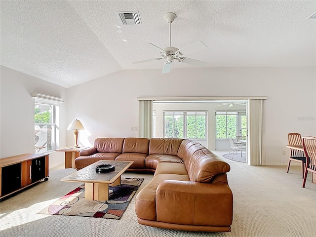 2202 Kershaw Rd, The Villages, FL 32162 - carpeted living room featuring ceiling fan, a textured ceiling, vaulted ceiling, and baseboards