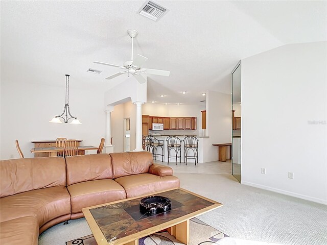 2202 Kershaw Rd, The Villages, FL 32162 - living room with decorative columns, a ceiling fan, light carpet, lofted ceiling, and baseboards