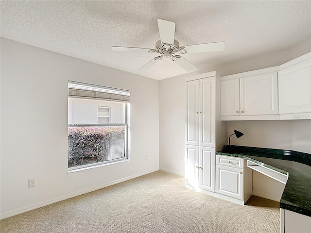 2202 Kershaw Rd, The Villages, FL 32162 - unfurnished office with built in study area, light carpet, ceiling fan, a textured ceiling, and baseboards